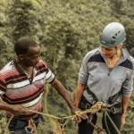 Instructor Backson giving abseiling instructions before descending